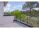 Modern balcony view offering a serene outdoor space with views of green trees and neighborhood views at 1012 Manor Way, Durham, NC 27701