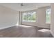 Spacious bedroom with ceiling fan and two windows providing plenty of natural light at 1012 Manor Way, Durham, NC 27701