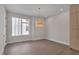 Dining room with ample light, wood floors, and a designer chandelier at 1012 Manor Way, Durham, NC 27701