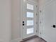 Modern white front door with glass panels, showcasing contemporary design elements at 1012 Manor Way, Durham, NC 27701