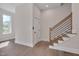 Hallway featuring hardwood floors, stairway and access to the outdoor balcony at 1012 Manor Way, Durham, NC 27701