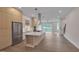 Bright, open kitchen boasts stainless appliances, a large island, and modern finishes at 1012 Manor Way, Durham, NC 27701