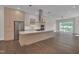 Modern kitchen features a large island, stainless steel appliances, and sleek cabinets at 1012 Manor Way, Durham, NC 27701