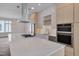 Modern kitchen features a large island, stainless appliances, and sleek cabinetry at 1012 Manor Way, Durham, NC 27701