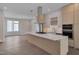 Open floor plan features a kitchen with cooktop island, and dining area at 1012 Manor Way, Durham, NC 27701