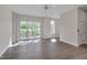 Open living area with hardwood floors and access to the outdoor balcony at 1012 Manor Way, Durham, NC 27701