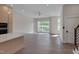 Bright living area with hardwood floors and direct access to the balcony at 1012 Manor Way, Durham, NC 27701
