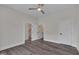 Bright main bedroom featuring hardwood floors and two closet doors at 1012 Manor Way, Durham, NC 27701