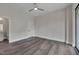 Light-filled main bedroom boasting hardwood floors, door to ensuite bathroom, and balcony access at 1012 Manor Way, Durham, NC 27701