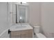 Stylish powder room featuring a modern vanity with white countertop and toilet at 1012 Manor Way, Durham, NC 27701