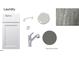 The laundry area showcases alpine cabinets, gray expo quartz countertops, and chrome fixtures at 1021 Azalea Garden Cir, Raleigh, NC 27603