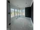 Living room with white wall trim, a black accent wall, and bright windows at 1021 Azalea Garden Cir, Raleigh, NC 27603