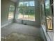 The living room features large windows, letting in ample natural light and offering picturesque outdoor views at 1021 Azalea Garden Cir, Raleigh, NC 27603