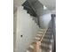 Staircase features wooden stairs, black metal railing and white vertical trim at 1021 Azalea Garden Cir, Raleigh, NC 27603