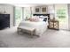 Large bedroom features a comfortable bed, neutral tones, and plenty of natural light creating a tranquil retreat at 1044 Country Pasture Cv, Wendell, NC 27591