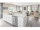 Modern kitchen open to the dining and living areas, stainless steel appliances, and a granite countertop at 1044 Country Pasture Cv, Wendell, NC 27591