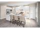 Bright kitchen features a large center island with barstool seating, stainless steel appliances, and ample storage at 1044 Country Pasture Cv, Wendell, NC 27591
