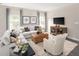 Comfortable living room with neutral tones, modern furniture, and plenty of natural light at 1044 Country Pasture Cv, Wendell, NC 27591
