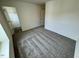 Bedroom featuring large window, plush carpeting, and walk-in closet at 10527 Brookside Reserve Rd, Raleigh, NC 27614