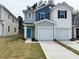 Charming two-story townhome with attached garage and well-manicured lawn at 10527 Brookside Reserve Rd, Raleigh, NC 27614