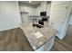 Bright kitchen featuring granite countertops, stainless appliances, and hardwood flooring at 10527 Brookside Reserve Rd, Raleigh, NC 27614