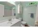 Fresh bathroom features a modern vanity, coordinated fixtures, and a skylight for natural light at 107 Piquot Dr, Louisburg, NC 27549