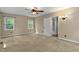 Neutral bedroom featuring carpet flooring, two windows and a ceiling fan at 107 Piquot Dr, Louisburg, NC 27549