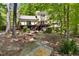 Scenic backyard featuring a deck, patio, hot tub, and natural landscape at 109 Bessemer Pl, Durham, NC 27712