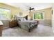 Cozy bedroom with soft carpet, neutral tones, and windows that frame the beautiful wooded view at 109 Bessemer Pl, Durham, NC 27712