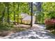 Charming yellow home with a long driveway and mature trees at 109 Bessemer Pl, Durham, NC 27712
