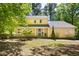 Charming two-story yellow home with a covered front porch and well-maintained landscaping at 109 Bessemer Pl, Durham, NC 27712