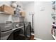 Well-organized laundry room featuring shelving and modern Samsung machines at 109 Bessemer Pl, Durham, NC 27712