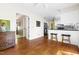 Spacious home with hardwood floors connecting the living area, kitchen, and hallways at 109 Bessemer Pl, Durham, NC 27712