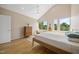Light filled primary bedroom features hardwood floors, vaulted ceilings and two windows at 1101 Norris St, Raleigh, NC 27604