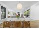 Open-concept dining room with large table, chairs and seamless transition to living area and outdoor patio at 1101 Norris St, Raleigh, NC 27604