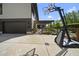 View of concrete driveway with basketball hoop and pergola covered outdoor living space in a backyard at 1101 Norris St, Raleigh, NC 27604