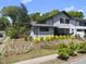 Well-maintained home featuring professional landscaping on a beautiful sunny day at 1101 Norris St, Raleigh, NC 27604
