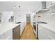 Spacious kitchen featuring a large island with sink and stainless steel appliances and fixtures at 1101 Norris St, Raleigh, NC 27604