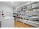 Well-organized laundry room with shelving and storage, making laundry chores a breeze at 1101 Norris St, Raleigh, NC 27604