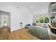Bright and spacious living room with hardwood floors, tall ceilings, and large windows at 1101 Norris St, Raleigh, NC 27604