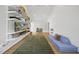 Living room with hardwood floors, tall ceilings, large windows, and plenty of storage at 1101 Norris St, Raleigh, NC 27604