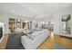 Open-concept living area with modern decor, natural light, and seamless flow to the backyard at 1101 Norris St, Raleigh, NC 27604