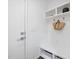 Bright mudroom features built-in storage bench, shelves and coat hooks, perfect for organization at 1101 Norris St, Raleigh, NC 27604