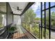 Relaxing covered porch with a ceiling fan, comfortable seating, and an outdoor view at 1101 Norris St, Raleigh, NC 27604