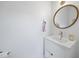 Chic powder room with modern vanity, stylish fixtures, and a minimalist design aesthetic at 1101 Norris St, Raleigh, NC 27604