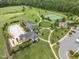 Community aerial view showcasing a pool, clubhouse, tennis courts, walking paths, and playground at 1104 Covered Bridge Trl, Chapel Hill, NC 27517