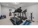 Spacious basement area that has exercise equipment with a glimpse into the dining room at 1104 Covered Bridge Trl, Chapel Hill, NC 27517