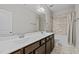 Bathroom features a double sink vanity, a large mirror, and a shower-tub combination, providing ample space at 1104 Covered Bridge Trl, Chapel Hill, NC 27517