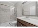 Bright bathroom featuring a glass-enclosed shower with gray tile surround and a modern single vanity at 1104 Covered Bridge Trl, Chapel Hill, NC 27517