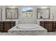 Bright bathroom featuring double vanities, a garden tub, and a large window offering natural light at 1104 Covered Bridge Trl, Chapel Hill, NC 27517